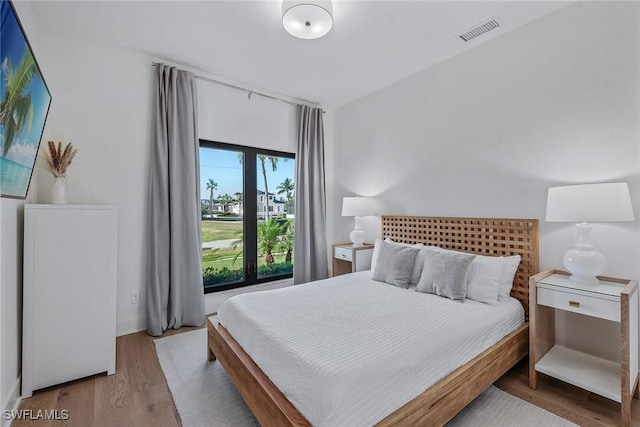 bedroom featuring wood finished floors