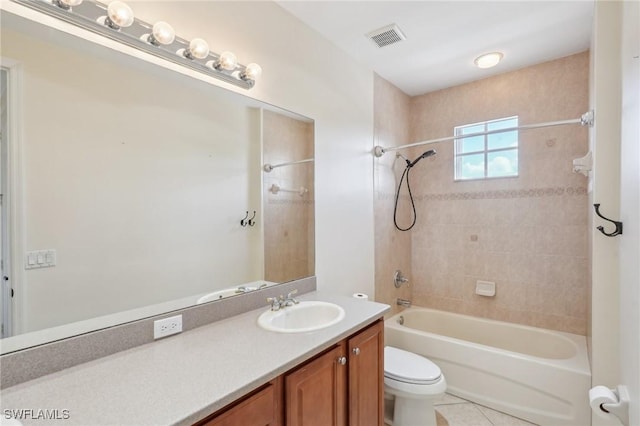 bathroom featuring shower / tub combination, toilet, vanity, and tile patterned flooring
