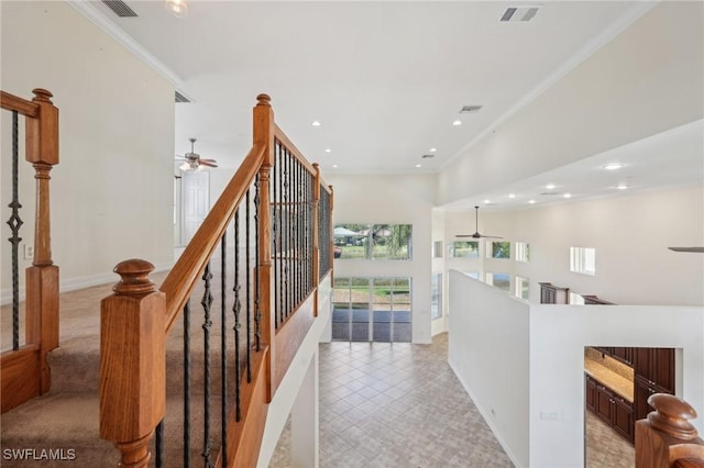 corridor with recessed lighting, ornamental molding, and baseboards