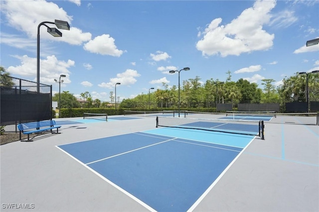 view of tennis court with fence