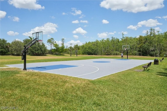view of basketball court featuring community basketball court and a yard