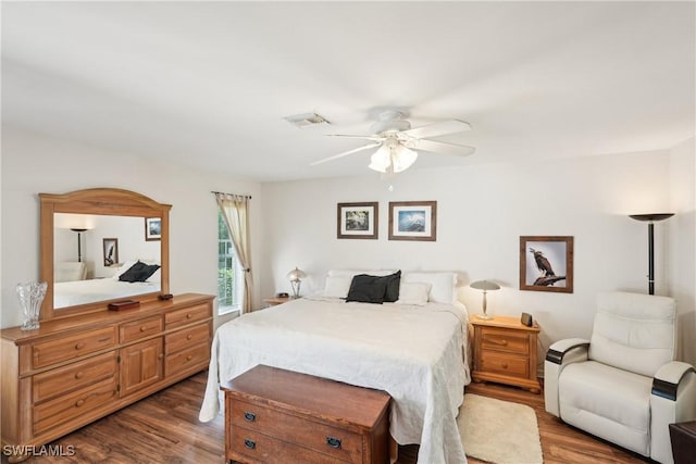 bedroom featuring wood finished floors and a ceiling fan