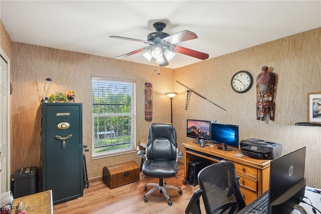 office area with wood finished floors and ceiling fan