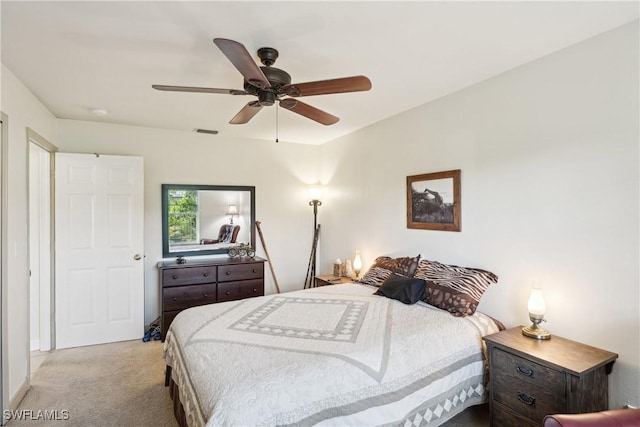 carpeted bedroom featuring ceiling fan