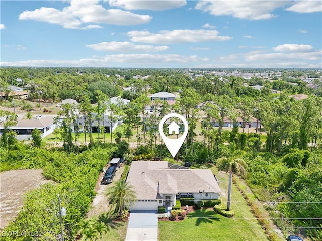 aerial perspective of suburban area with a tree filled landscape