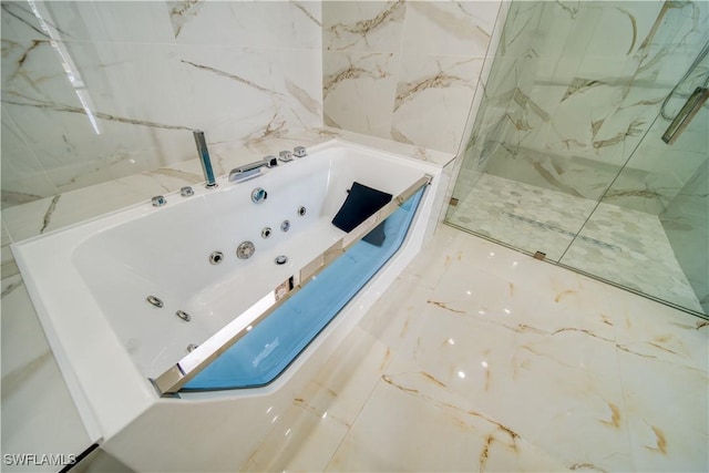 710 SW 25th Ln, Cape Coral, FL 33914 - bathroom with a jetted tub and a marble finish shower