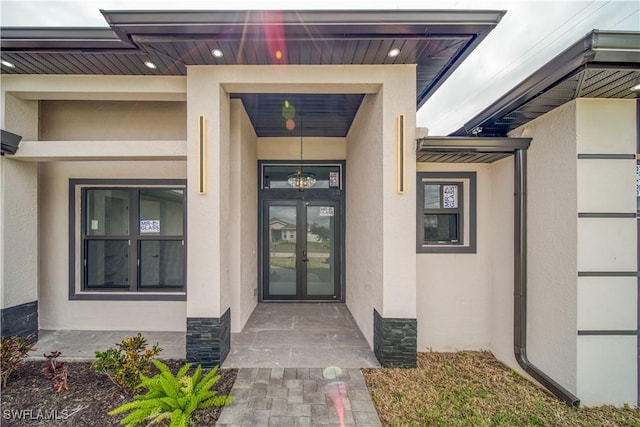 710 SW 25th Ln, Cape Coral, FL 33914 - property entrance featuring stucco siding and french doors
