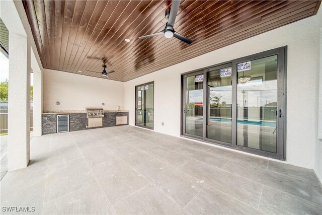 710 SW 25th Ln, Cape Coral, FL 33914 - view of patio with a ceiling fan, area for grilling, a grill, and beverage cooler