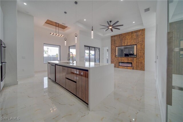 710 SW 25th Ln, Cape Coral, FL 33914 - kitchen featuring modern cabinets, light marble finish floors, dishwasher, a sink, and a ceiling fan