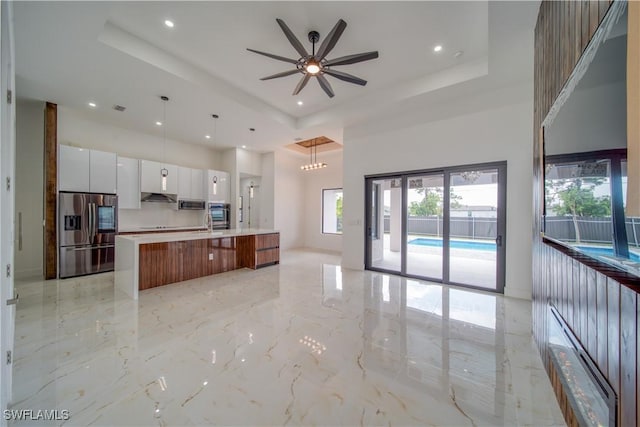 710 SW 25th Ln, Cape Coral, FL 33914 - kitchen featuring appliances with stainless steel finishes, modern cabinets, a raised ceiling, open floor plan, and recessed lighting
