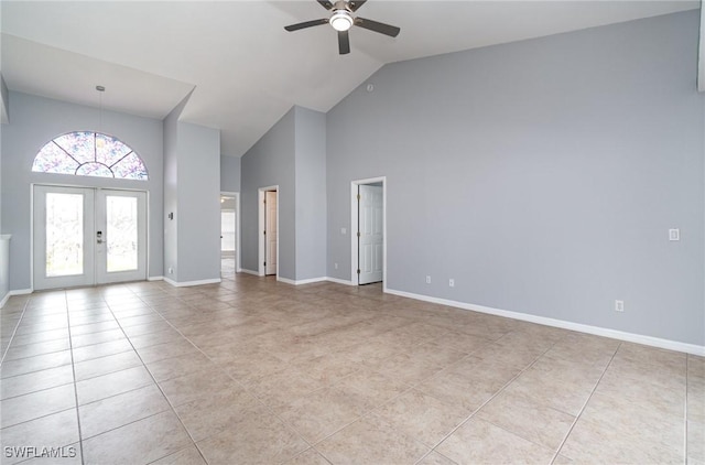 3113 SW 22nd Pl, Cape Coral, FL 33914 - foyer entrance with high vaulted ceiling, ceiling fan, light tile patterned floors, french doors, and baseboards