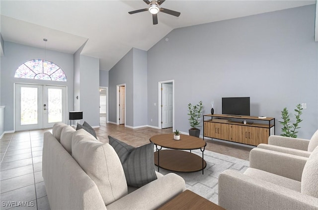 3113 SW 22nd Pl, Cape Coral, FL 33914 - living area with high vaulted ceiling, tile patterned flooring, a ceiling fan, french doors, and baseboards