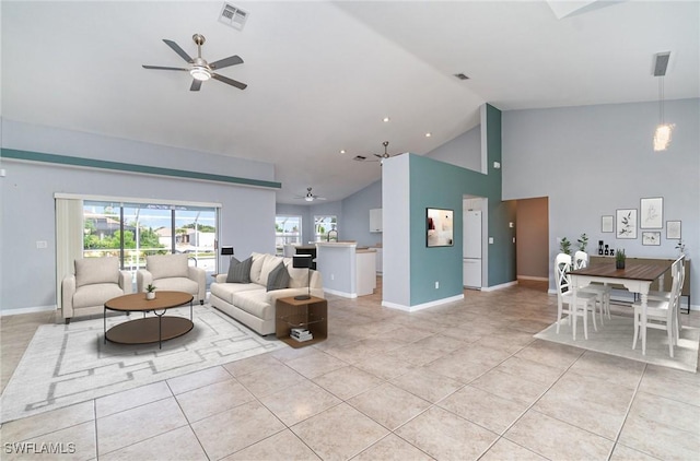 3113 SW 22nd Pl, Cape Coral, FL 33914 - living area featuring a ceiling fan, high vaulted ceiling, light tile patterned floors, and baseboards