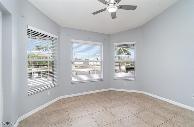 3113 SW 22nd Pl, Cape Coral, FL 33914 - unfurnished room featuring ceiling fan, light tile patterned floors, and baseboards