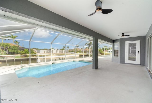 3113 SW 22nd Pl, Cape Coral, FL 33914 - swimming pool featuring ceiling fan, a patio area, a water view, and glass enclosure