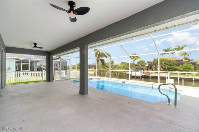 3113 SW 22nd Pl, Cape Coral, FL 33914 - outdoor pool featuring a ceiling fan, a patio, and glass enclosure