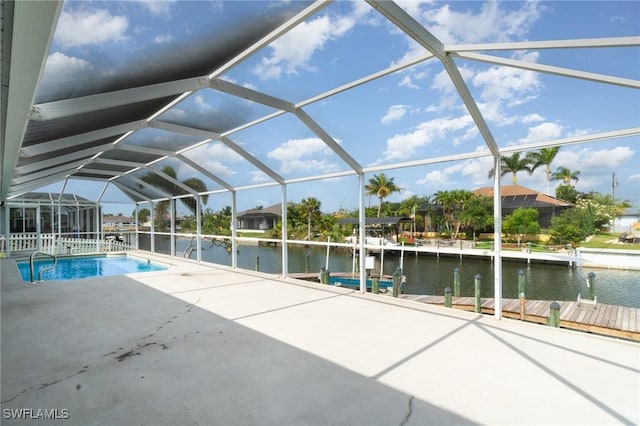 3113 SW 22nd Pl, Cape Coral, FL 33914 - outdoor pool with a water view, a patio, a boat dock, and glass enclosure