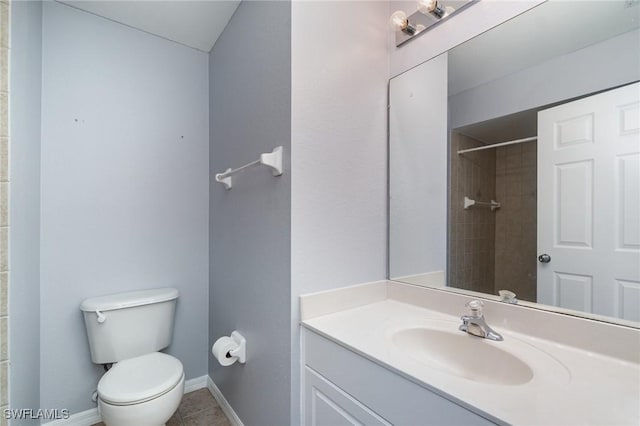 3113 SW 22nd Pl, Cape Coral, FL 33914 - full bath featuring toilet, vanity, tile patterned flooring, a shower, and baseboards
