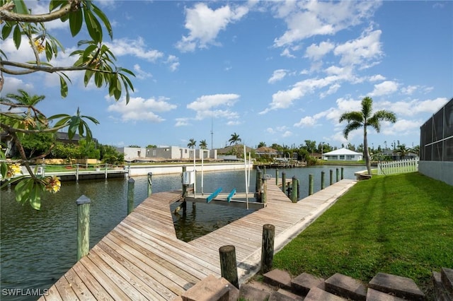 3113 SW 22nd Pl, Cape Coral, FL 33914 - dock area with boat lift, a water view, a yard, and a residential view