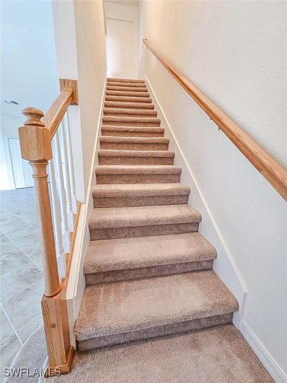 2685 Citrus St, Naples, FL 34120 - stairway featuring baseboards