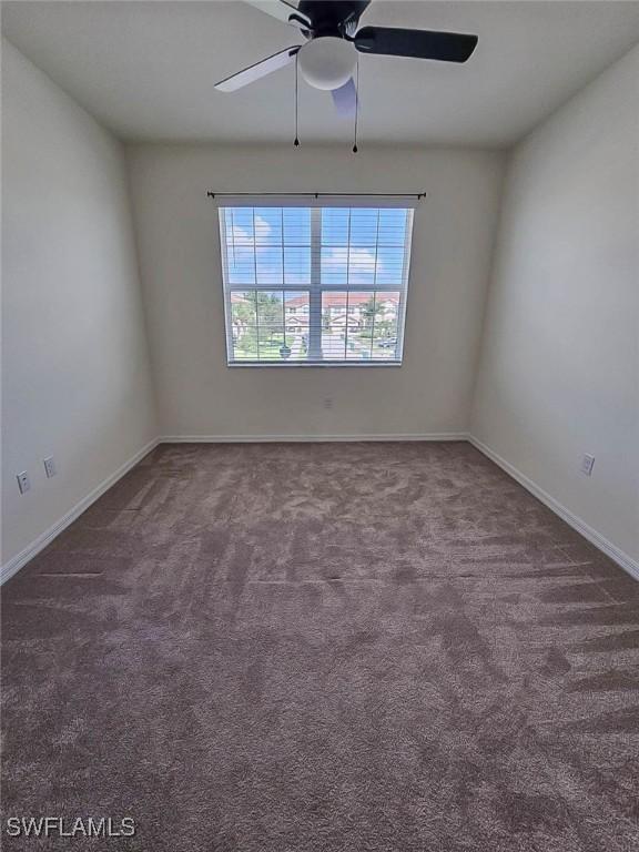 2685 Citrus St, Naples, FL 34120 - unfurnished room with carpet flooring, baseboards, and a ceiling fan