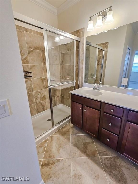 2685 Citrus St, Naples, FL 34120 - bathroom with a shower stall, ornamental molding, vanity, and tile patterned flooring