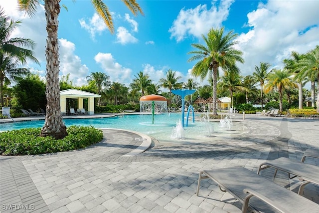 2685 Citrus St, Naples, FL 34120 - community pool featuring a patio area