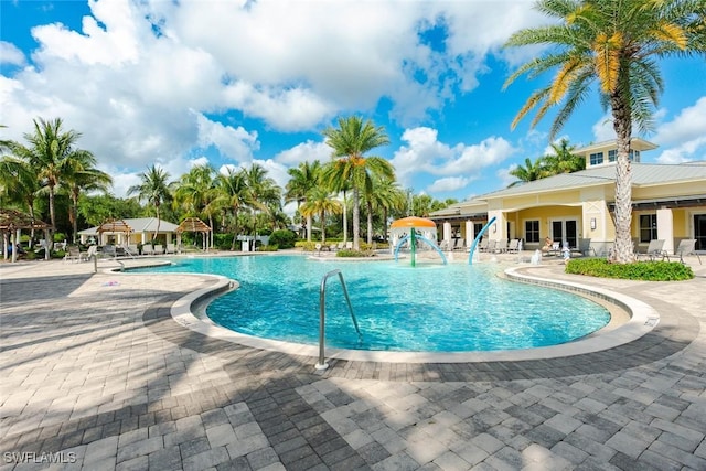 2685 Citrus St, Naples, FL 34120 - community pool with a patio area
