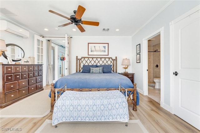 bedroom with a wall mounted air conditioner, wood finished floors, crown molding, recessed lighting, and connected bathroom