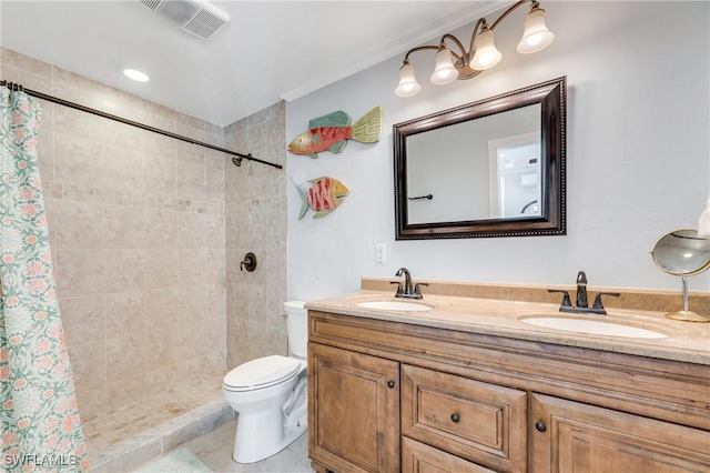 full bath with toilet, a tile shower, double vanity, and tile patterned flooring