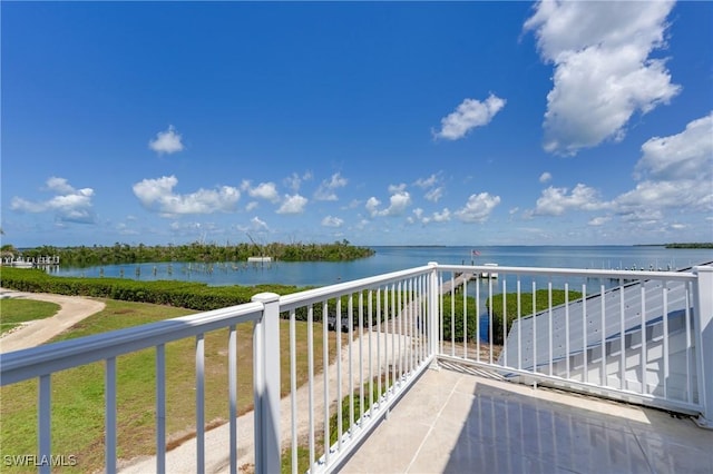 balcony featuring a water view
