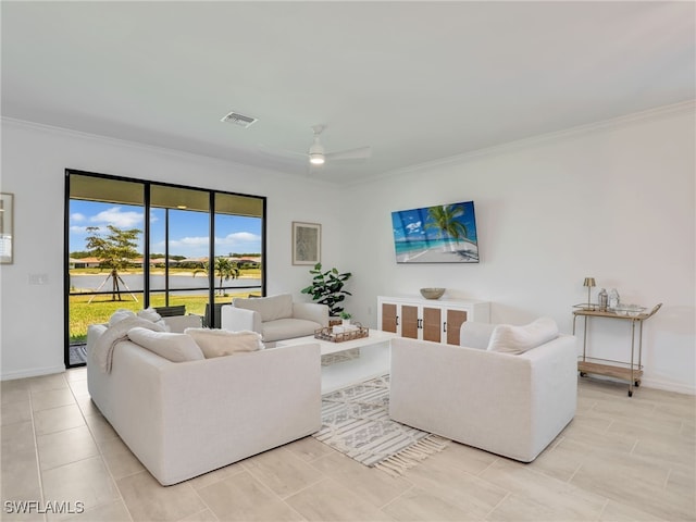 living room with ornamental molding, ceiling fan, and baseboards