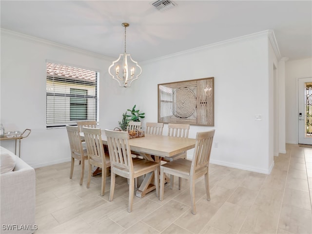 dining room featuring a chandelier, plenty of natural light, crown molding, baseboards, and light wood finished floors