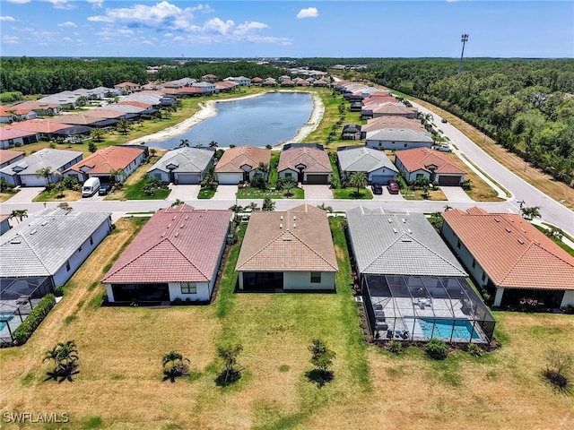 aerial view of residential area featuring a large body of water