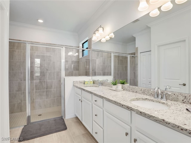 full bathroom featuring a stall shower, double vanity, ornamental molding, and tile patterned flooring