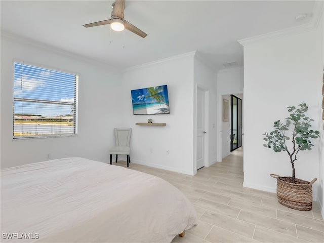 bedroom featuring ornamental molding, baseboards, and a ceiling fan