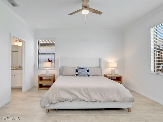 bedroom with ornamental molding, light tile patterned floors, baseboards, ensuite bathroom, and a ceiling fan