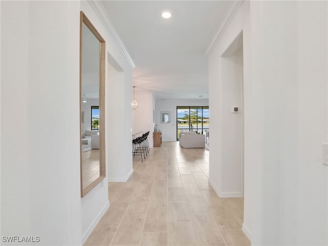 hall featuring baseboards, recessed lighting, and light tile patterned floors