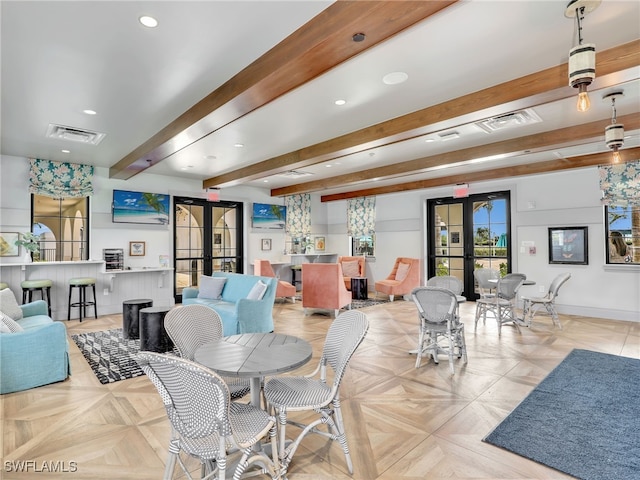 dining room with french doors, beamed ceiling, recessed lighting, and baseboards