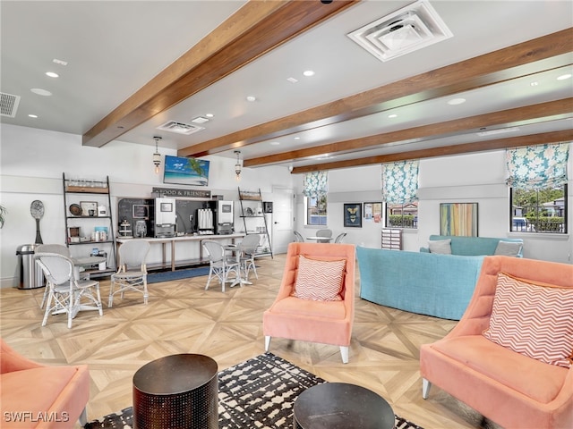 living area with recessed lighting, beamed ceiling, and a desk