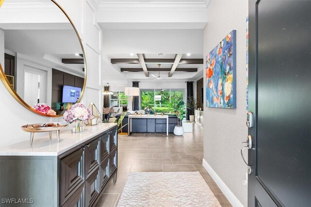 tiled entryway with coffered ceiling, beamed ceiling, recessed lighting, and ornamental molding