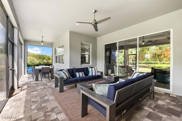view of patio featuring an outdoor hangout area, a ceiling fan, and outdoor dining area