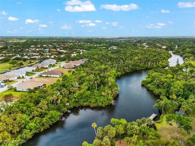 aerial view of residential area with a large body of water