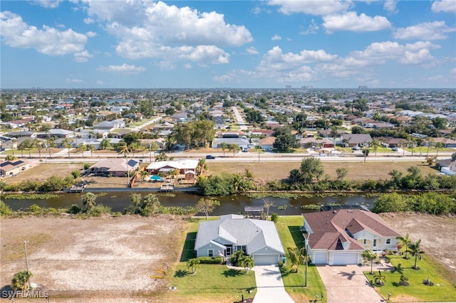 614 SW 31st Ter, Cape Coral, FL 33914 - aerial perspective of suburban area featuring a nearby body of water
