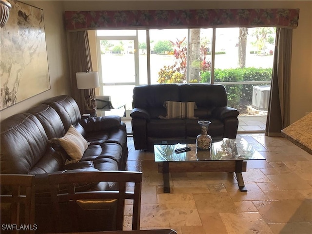living room featuring stone tile floors