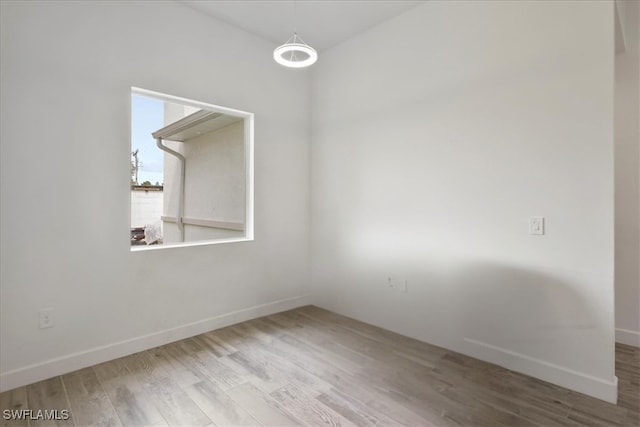 409 Columbus Blvd S, Lehigh Acres, FL 33974 - empty room featuring wood finished floors and baseboards