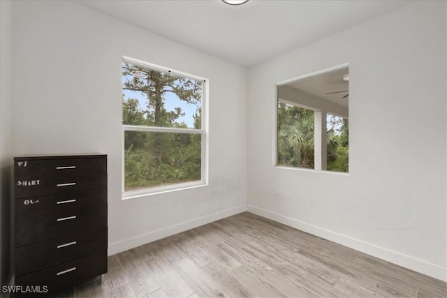 409 Columbus Blvd S, Lehigh Acres, FL 33974 - spare room featuring light wood finished floors, baseboards, and a ceiling fan