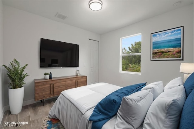 409 Columbus Blvd S, Lehigh Acres, FL 33974 - bedroom featuring light wood finished floors and baseboards