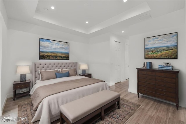 409 Columbus Blvd S, Lehigh Acres, FL 33974 - bedroom with a raised ceiling, recessed lighting, light wood-style flooring, and baseboards
