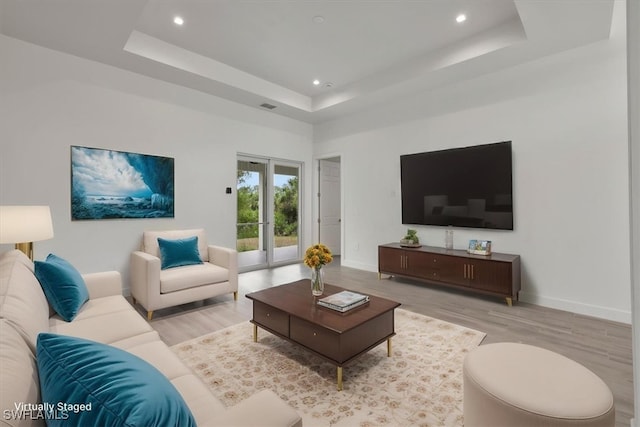 409 Columbus Blvd S, Lehigh Acres, FL 33974 - living area featuring wood finished floors, a raised ceiling, recessed lighting, and baseboards
